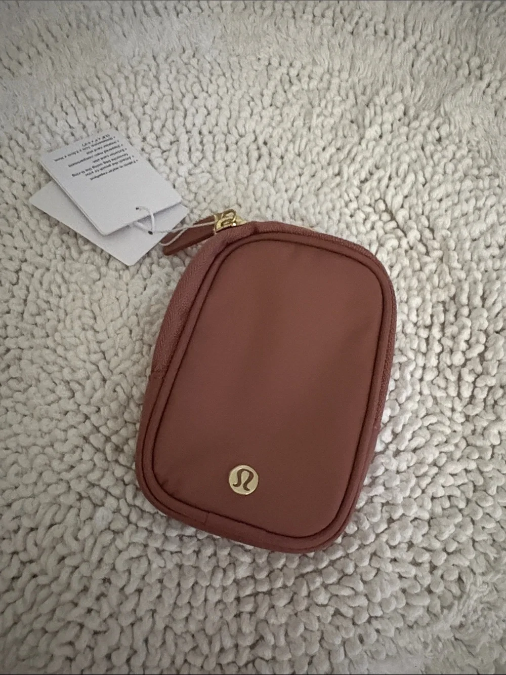 Lululemon mauve small zip pouch with gold logo